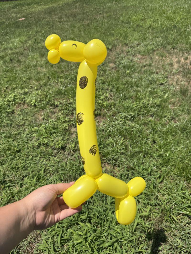 Yellow spotted balloon giraffe at a Texas kids party